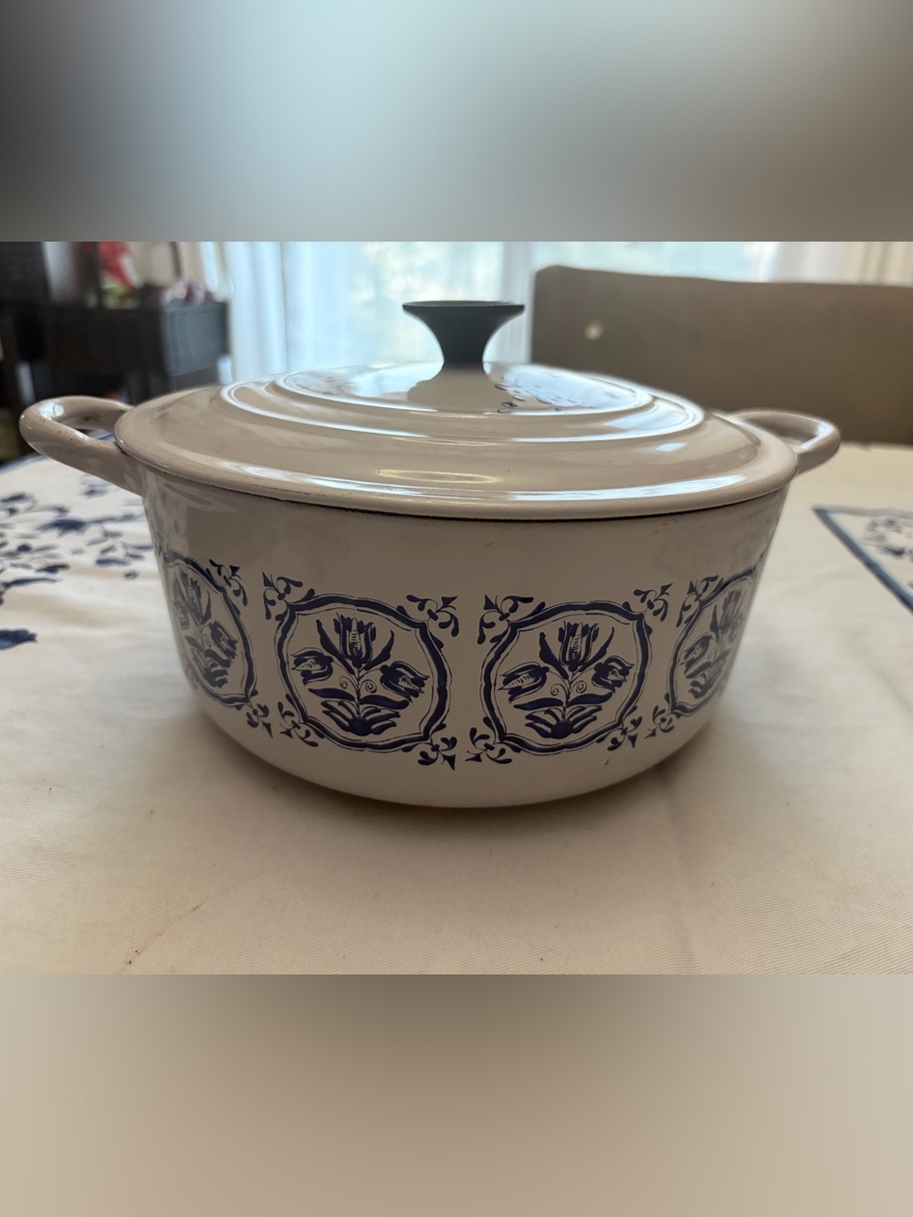 Vintage Le Creuset cream enamel Dutch oven with blue tulip pattern